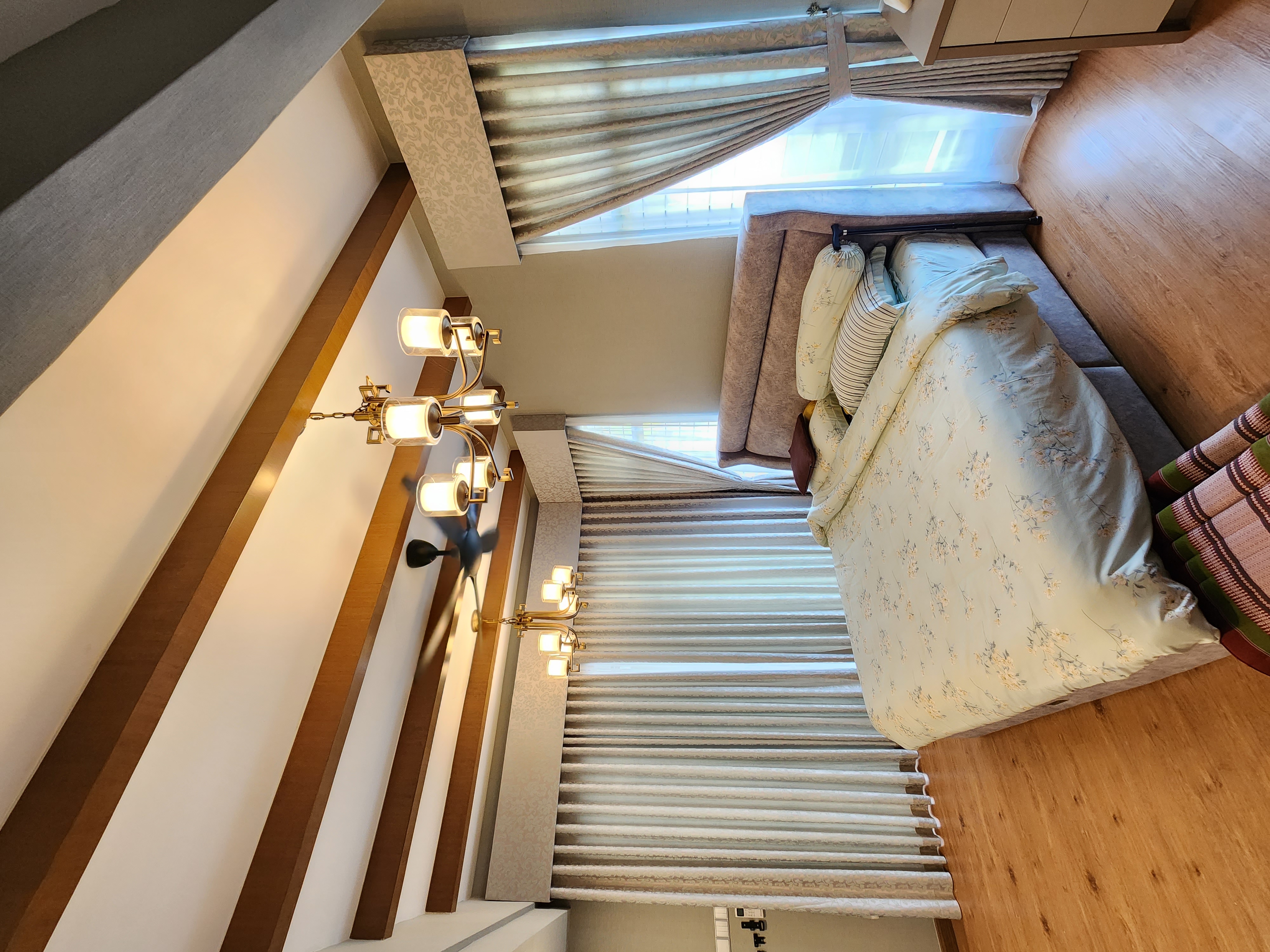 A bedroom with blackout blinds for a peaceful sleep environment
